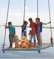  ?? ANI ?? Volunteers carry idols of Hindu deity Ganesha in a crane for immersion in the Hussain Sagar Lake, in Hyderabad.