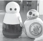  ??  ?? The robotic home companion Kuri, left, with BB-8 of Star Wars fame.