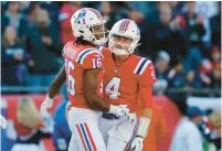  ?? MICHAEL DWYER/AP ?? Patriots wide receiver Jakobi Meyers celebrates a touchdown catch with rookie quarterbac­k Bailey Zappe in the second half Sunday against the Lions.