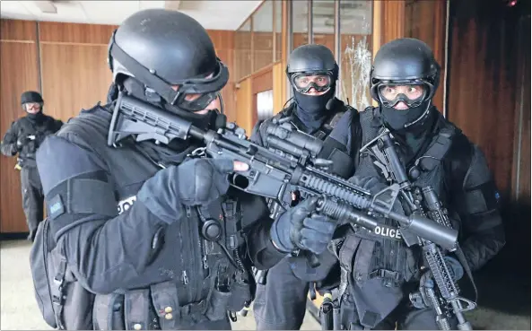  ??  ?? Dangerous job: Armed Offenders Squad members at a recent training session.
