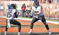  ??  ?? Baltimore Ravens tight end Mark Andrews (89) celebrates with wide receiver Marquise Brown (15), both former Sooners, after Andrews scored a 39-yard touchdown against the Cleveland Browns on Sunday. [AP PHOTO/DAVID RICHARD]