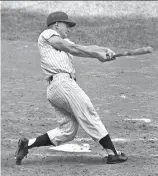  ?? Associated Press 1961 ?? Roger Maris connects with a Tracy Stallard pitch for a then-record 61st homer in 1961.