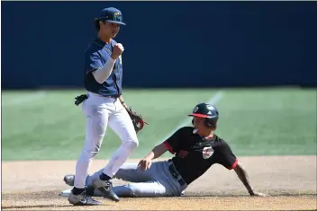  ?? PHOTOS BY ANDY HOLZMAN ?? Brandon Gonzaga reacts after completing a double play for Notre Dame, which defeated Orange Lutheran in extra innings.