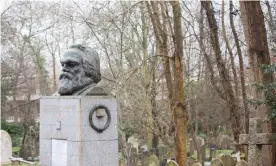  ??  ?? Karl Marx’s grave in Highgate cemetery. CCTV cameras have been fitted to trees next to the grave. Photograph: Graeme Robertson/The Guardian