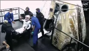  ?? (AP/NASA) ?? In this video still, the European Space Agency’s Matthias Maurer exits the SpaceX Dragon space capsule after splashing down early Friday in the Gulf of Mexico off Tampa, Fla.