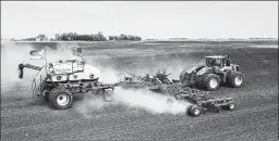  ?? DAN ERDMANN/FARM RESCUE ?? Volunteers plant crops in June on Paul Ivesdal’s farm while he was sickened by COVID-19.