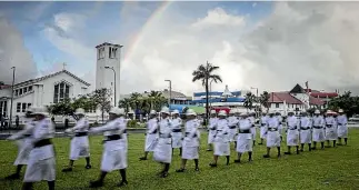  ??  ?? Above: The honour guard assembles in Apia, Samoa. Right: Prime Minister Jacinda Ardern waits to inspect the troops.