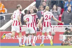  ??  ?? Stoke City’s Spanish striker Jese (C) celebrates with teammates after scoring the opening goal of the English Premier League football match between Stoke City and Arsenal at the Bet365 Stadium in Stoke-on-Trent, central England on August 19, 2017. -...