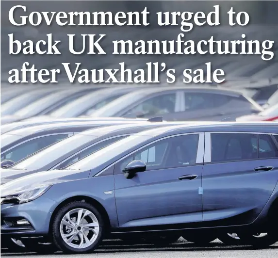  ?? Christophe­r Furlong ?? > There are jobs fears in Wales after Vauxhall’s Ellesmere Port plant was sold to PSA as part of a £1.9bn deal