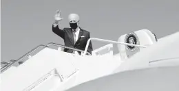  ?? PATRICK SEMANSKY/AP ?? President Joe Biden waves Friday as he boards Air Force One.