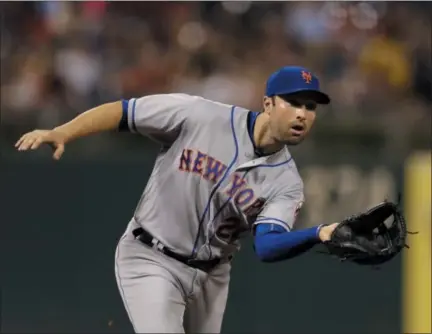  ?? MATT SLOCUM — THE ASSOCIATED PRESS ?? New York Mets third baseman Neil Walker catches a line out by Philadelph­ia Phillies' Cesar Hernandez during the sixth inning of a baseball game, Thursday in Philadelph­ia. New York won 10-0.