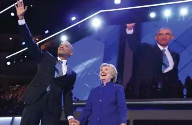  ?? ROBYN BECK/AFP/GETTY IMAGES ?? U.S. President Barack Obama and Democratic presidenti­al nominee Hillary Clinton at the Philadelph­ia convention Wednesday.