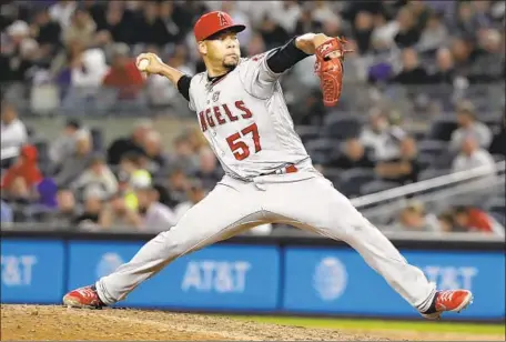  ?? Frank Franklin II Associated Press ?? ANGELS CLOSER Hansel Robles pitched the ninth inning to earn his 22nd save. He struck out two and allowed one hit.