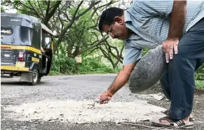  ??  ?? Dadarao has been filling potholes in his city to prevent other families from going through the grief he did when he lost his son. — TNS