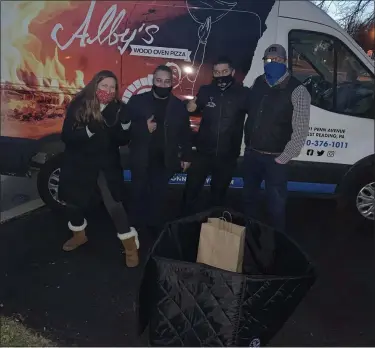  ?? COURTESY OF HEATHER BRADY ?? A family meal pop-up crew, from left, Heather Brady, Raf Cirandine, co-owner of Nonno Alby’s of West Reading, Massimo Grande, co-owner of Nonno Alby’s, and Jeff Trupe, a neighbor. Since December, 27 family meal pop-up events have been held.