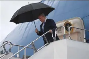  ?? SUSAN WALSH ?? President Donald Trump walks down the steps of Air Force One at Osaka Internatio­nal (Itami) Airport, in Osaka, Japan, Thursday, June 27, 2019. Trump is in Osaka to attend the G20 summit.