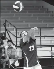  ?? Westside Eagle Observer/MIKE ECKELS ?? On the third contact, Lady Bulldog Ithzel Martinez attempts to send the ball over the net into Lady Leopard territory during the second set of the Decatur-Alpena match Aug. 23.