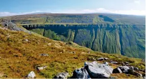  ??  ?? High Cup – a first glimpse of the great gulch seen from the south end of Backstone Edge. The well-known name High Cup Nick refers to the notch at the head of the valley.