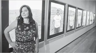  ?? NAKITA KRUCKER TORONTO STAR FILE PHOTO ?? Wanda Nanibush stands beside a piece done by Indigenous artist Shelley Niro entitled "The Shirt" at the AGO.