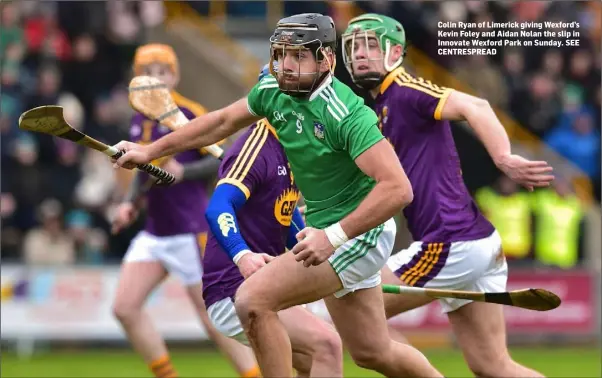  ??  ?? Colin Ryan of Limerick giving Wexford’s Kevin Foley and Aidan Nolan the slip in Innovate Wexford Park on Sunday. SEE CENTRESPRE­AD