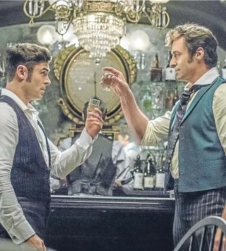  ?? Picture: PA. ?? Deal me in: Zac Efron, left, helps to finance the dream of Hugh Jackman in The Greatest Showman.