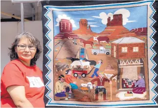  ?? COURTESY OF GABRIELLA MARKS ?? Native artist Florence Riggs is seen with one of her weavings.