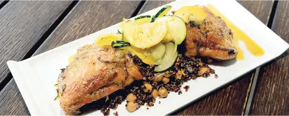  ??  ?? The Best Dressed Chicken’s featured item on the Uncorked Mother’s Day brunch menu – rustic herb and bell pepper roasted chicken thighs, served with a warm chick pea and quinoa salad, topped with a warm chicken au jus.