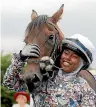  ?? AP ?? Khadijah Mellah, 18, celebrates with her horse Haverland after winning the Magnolia Cup in Chichester, England.