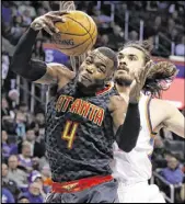  ?? SUE OGROCKI / ASSOCIATED PRESS ?? Forced to play center after Dwight Howard was scratched, Paul Millsap finished with 30 points and 11 rebounds Monday as the Hawks defeated Oklahoma City.