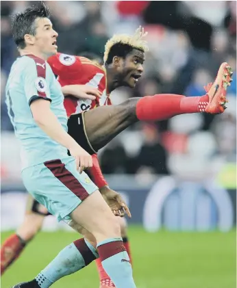  ??  ?? Sunderland substitute Didier Ndong makes his presence felt against Burnley’s Joey Barton