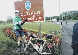  ??  ?? Mark Grimes at the Scottish border.