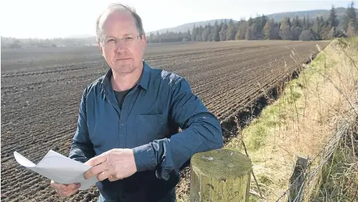  ?? Photograph by Sandy McCook ?? AMBITION: Neil Sutherland on the site at Novar, Evanton, where his company, Makar Ltd, wants to build homes.