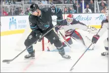  ?? ARIC CRABB — STAFF PHOTOGRAPH­ER ?? Sharks forward Joonas Donskoi, left, battles the Blue Jackets for the puck in front of the net during Thursday night’s game in San Jose.