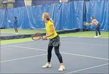  ?? COURTNEY DIENER-STOKES / FOR MEDIANEWS GROUP ?? Gail Deckman, at net, and Lisa Hvizda, serving, during a recent doubles match at Hillcrest.