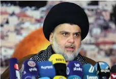  ?? AFP ?? Iraq’s powerful Shiite cleric Moqtada Al Sadr has criticised Haider Al Abadi for aligning himself with Iran-backed militias