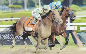  ?? AP PHOTO ?? FROZEN OUT: Keen Ice, with Javier Castellano up, surges past Triple Crown winner American Pharoah and jockey Victor Espinoza en route to an upset win in the Travers Stakes yesterday at Saratoga Race Course.