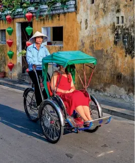  ??  ?? Hoan Kiem Lake in Hanoi offers spectacula­r photo ops.
In Vietnam, pedicabs have their passenger seats in the front.
Above: Cafe Giang serves a mean cup of egg coffee, known locally as