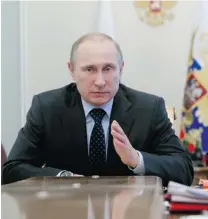  ?? SER GEI KARPUKHIN/ THE ASSOCIATED PRESS ?? Rus sian President Vlad i mir Putin speaks at a cab inet meet ing Wed nes day. He has im posed bans on goods and raised nat ural gas prices to squeeze the cit izens of Ukraine.