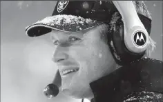  ?? JOSE CARLOS FAJARDO/TRIBUNE NEWS SERVICE ?? Oakland Raider coach Jon Gruden shows off a big smile as his team warms up before the start of their game against the New England Patriots during their AFC playoff game on January 19, 2002.