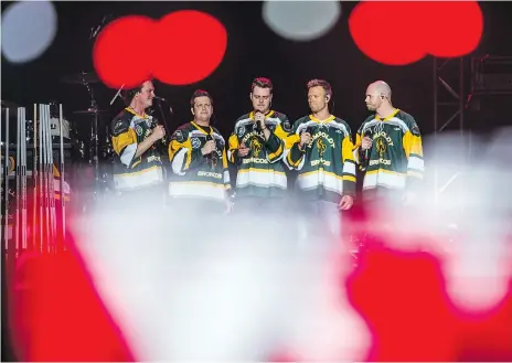 ??  ?? Saskatchew­an’s Hunter Brothers sing the national anthem at the beginning of the Country Thunder Humboldt Broncos Tribute Concert at SaskTel Centre on Friday night. Thousands turned out for the fundraiser featuring well-known country music stars and...