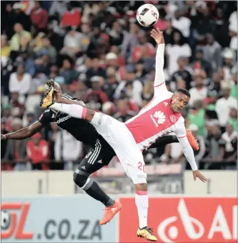  ?? PICTURE: BACKPAGEPI­X ?? Edwin Gyimah of Orlando Pirates battles for the ball with Erwin Isaacs of Ajax Cape Town during their Absa Premiershi­p match at Cape Town Stadium last night.