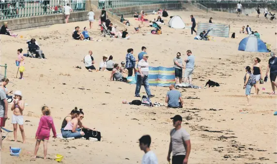  ??  ?? Bank Holiday Monday at Seaburn beach.