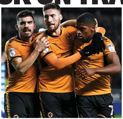  ?? GETTY ?? Top dogs: Matt Doherty (centre) celebrates his opener with Ruben Neves and Ivan Cavaleiro