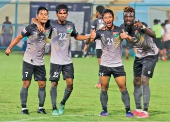  ?? ?? Sreenidi Deccan Football Club’s Lalromawia (second from right) celebrates with teammates after scoring against defending champions Gokulam Kerala in their penultimat­e championsh­ip phase game in Naihati, West Bengal.