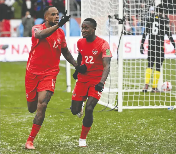  ?? DAN HAMILTON/USA TODAY SPORTS ?? Forward Cyle Larin, left, has 25 goals for Canada and is one of the players the team is depending on to provide scoring at the World Cup in Qatar.
Canada is hoping not to repeat its previous World Cup effort in 1986, when the team did not score a goal in three matches.