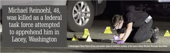  ??  ?? A Washington State Patrol Crime Lab worker looks at evidence markers at the scene where Michael Reinoehl was killed.