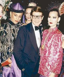  ??  ?? Yves Saint Laurent with his models at the Opium launch party of 1978