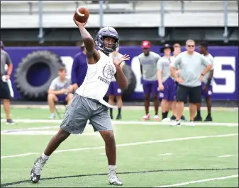  ?? NWA Democrat Gazette/SPENCER TIREY ?? Fayettevil­le quarterbac­k Darius Bowers throws a pass Friday during the Southwest Elite 7-on-7 tournament at Harmon Field on the campus of Fayettevil­le High School.