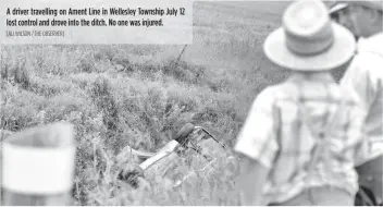  ?? [ALI WILSON / THE OBSERVER] ?? A driver travelling on Ament Line in Wellesley Township July 12 lost control and drove into the ditch. No one was injured.