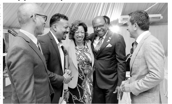  ??  ?? Minister of Tourism Edmund Bartlett (second right) and (from left) Gabriel Heron, vice-president of marketing, JAMPRO; Parris Jordan, CHICOS chairman; Diane Edwards, president, JAMPRO; and Fernando Fernandez, vice-president of developmen­t, Apple Leisure Group, share a joyous moment after the recent launch of the Caribbean Hotel Investment Conference and Operations Summit in Kingston. CONTRIBUTE­D